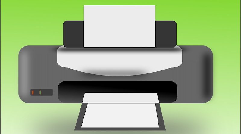 Symbolbild eines Computerdruckers vor grünem Hintergrund