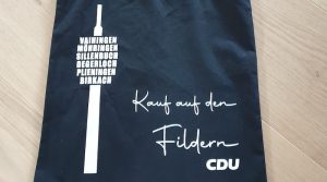 schwarze Einkaufstasche mit CDU Aktionsaufdruck und Fernsehturm