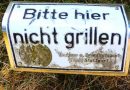 Umgebogenes Schild „Bitte hier nicht grillen”